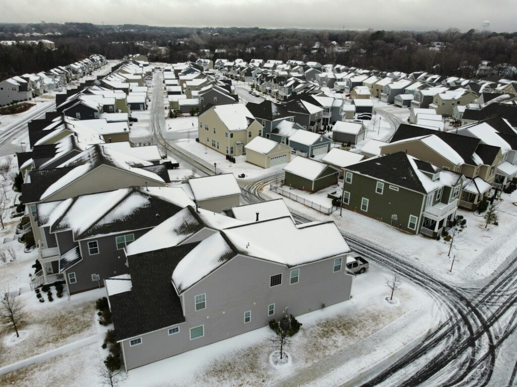 an aerial view of a neighborhood in winter