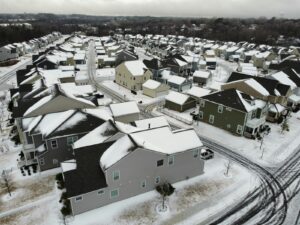 an aerial view of a neighborhood in winter