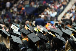 A large group of people in graduation caps and gowns