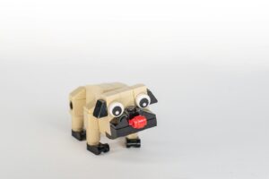 brown robot toy on white surface