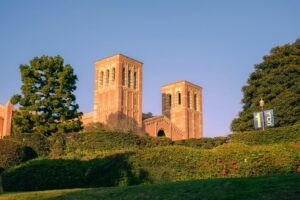 A building with two towers on top of a hill